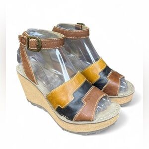 Fly London Glam Gody661 wedge sandals in tan, black, and mustard leather